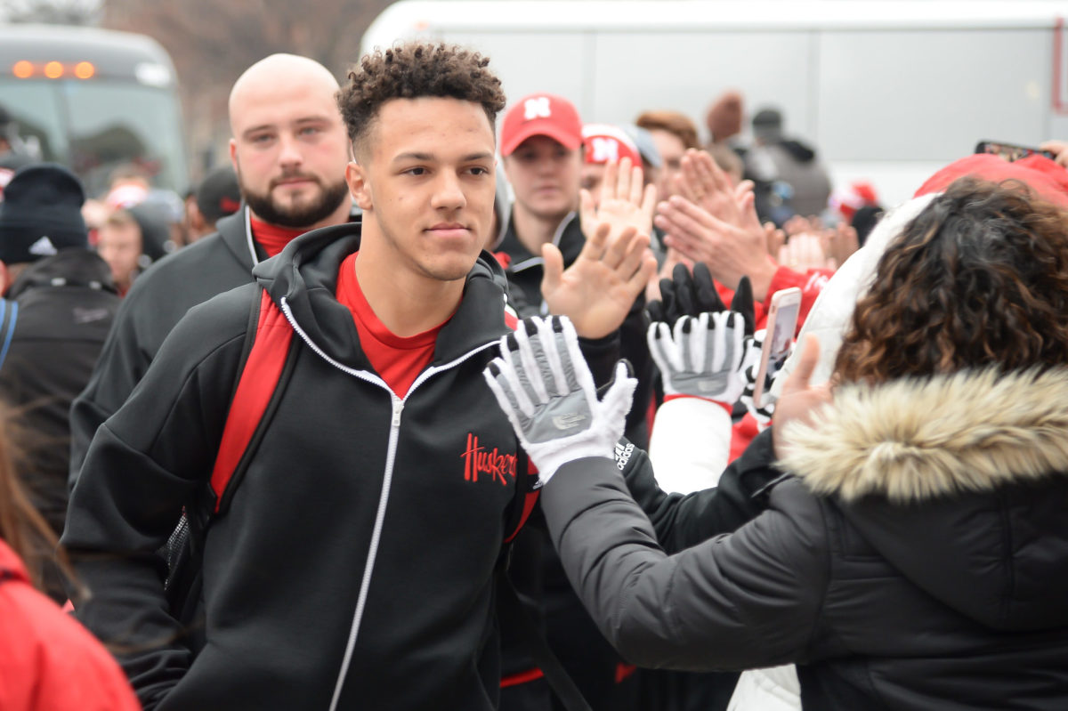 Adrian Martinez and the Nebraska Cornhuskers being greeted by fans.