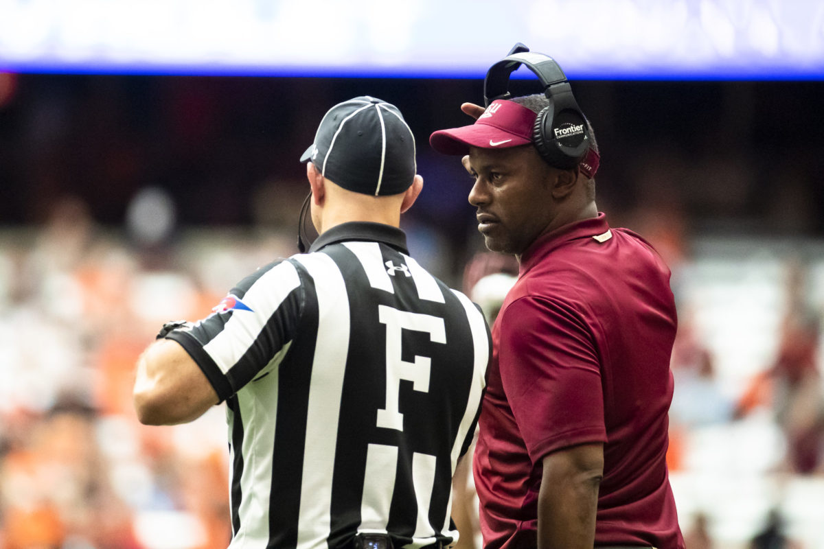 Florida State coach Willie Taggart talking to a referee.