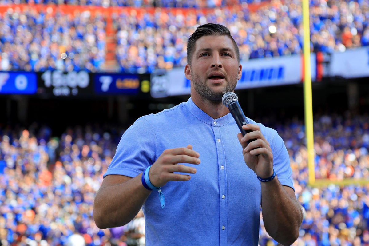 Tim Tebow giving a speech during a Florida Gators football game.
