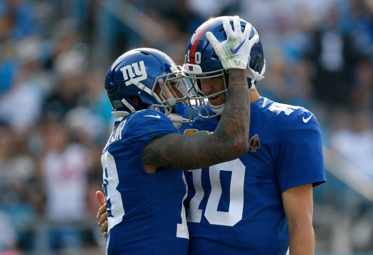Odell Beckham Jr. and Eli Manning congratulate each other during a game for the New York Giants.