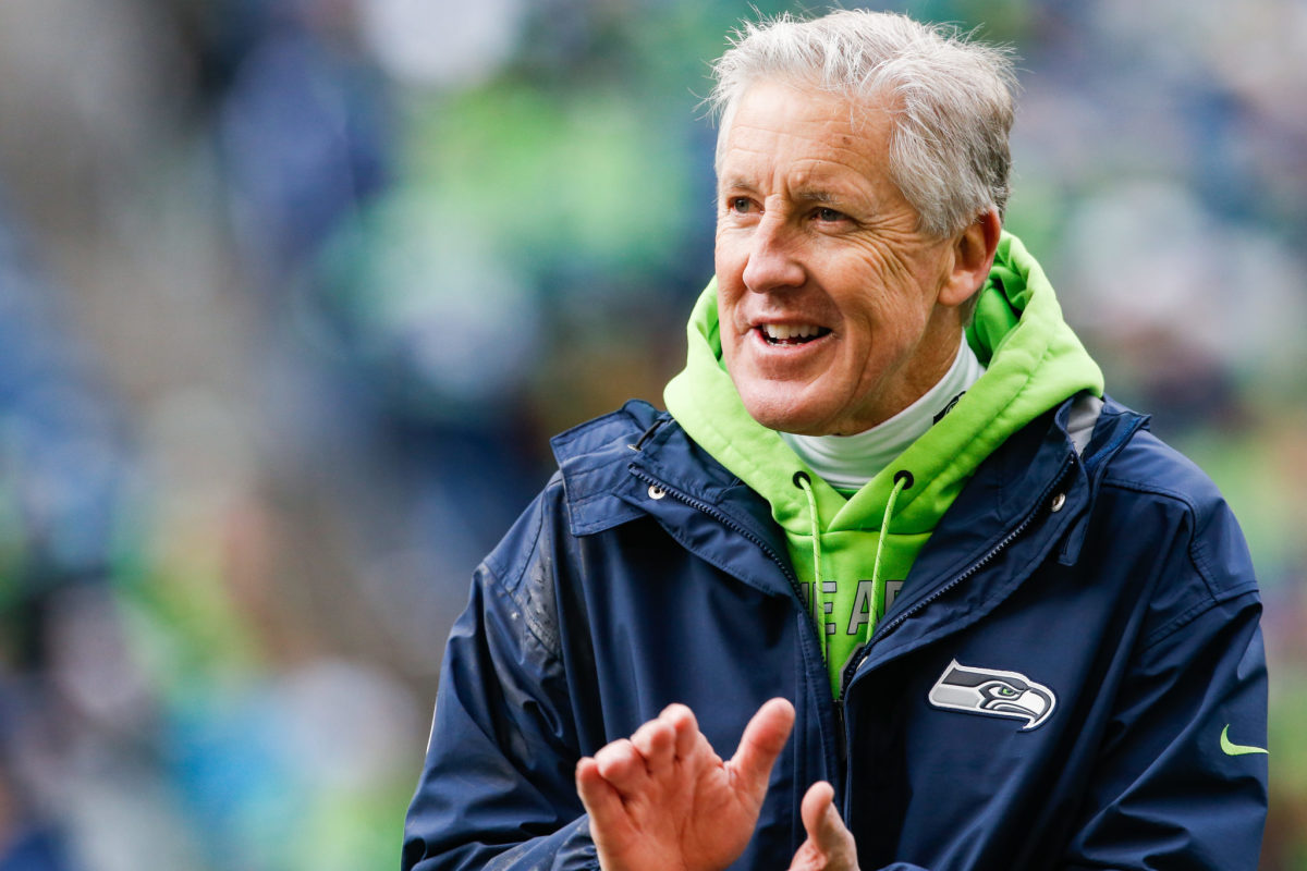 A closeup of Seattle Seahawks coach Pete Carroll clapping.
