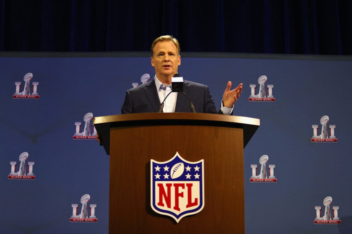 Roger Goodell, NFL commissioner, talking at a podium at the Super Bowl.