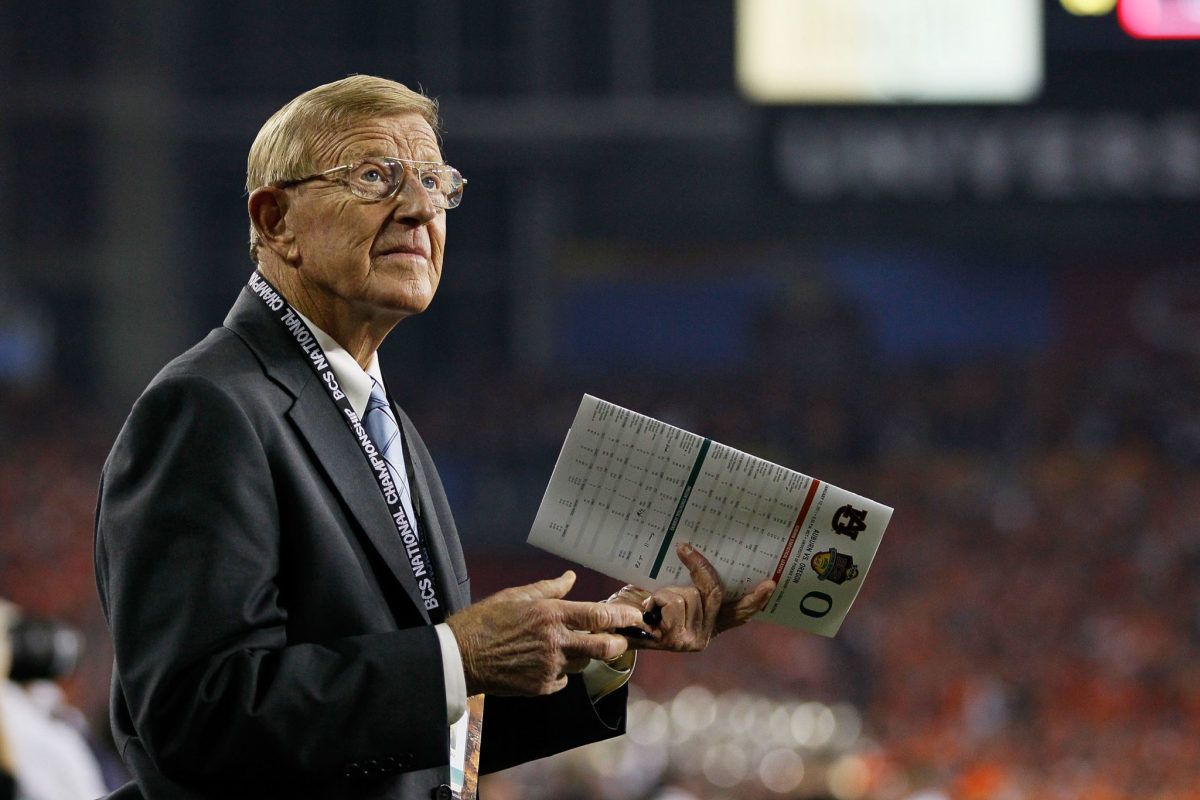 Lou Holtz on the field before a game.