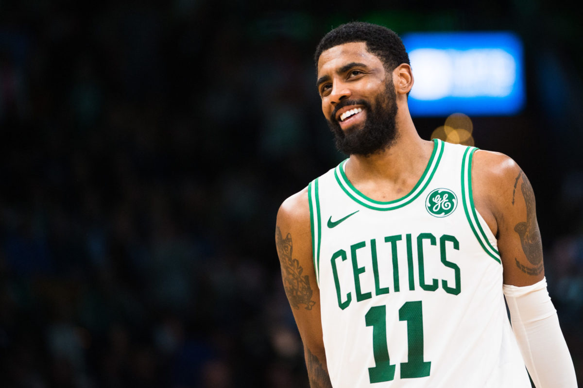 Kyrie Irving smiling during a game.