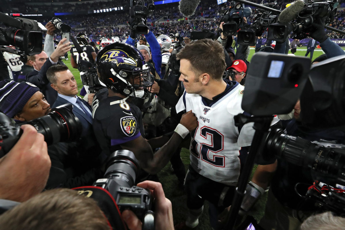 Lamar Jackson and Tom Brady greet each other after the Ravens beat the Patriots.