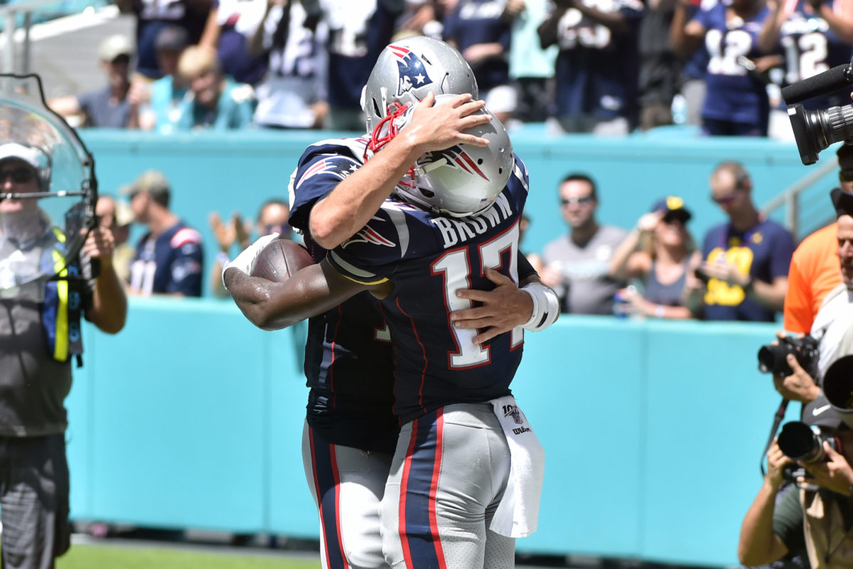 Antonio Brown and Tom Brady celebrate a Patriots touchdown.