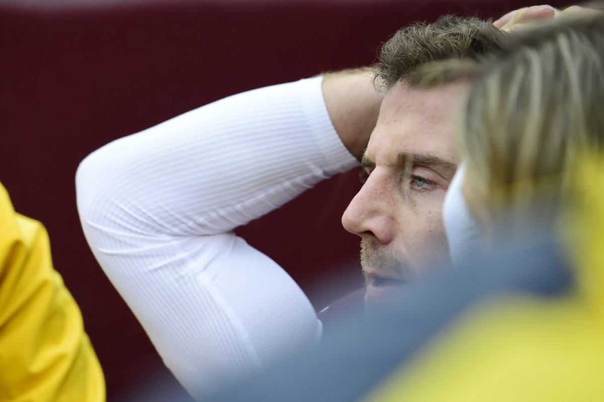 Alex Smith reacting to his injury as he's being taken off the field.
