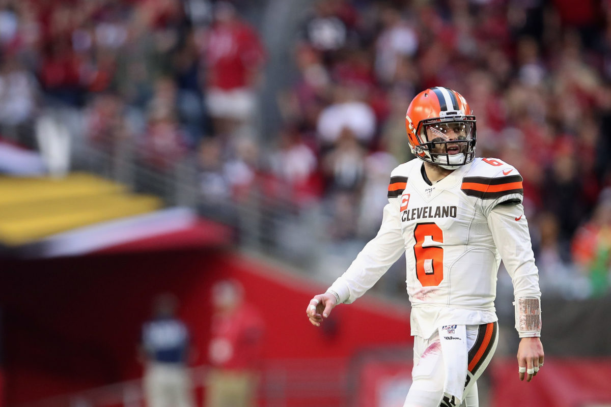 Baker Mayfield walks off the field after Cleveland Browns loss to the Cardinals.