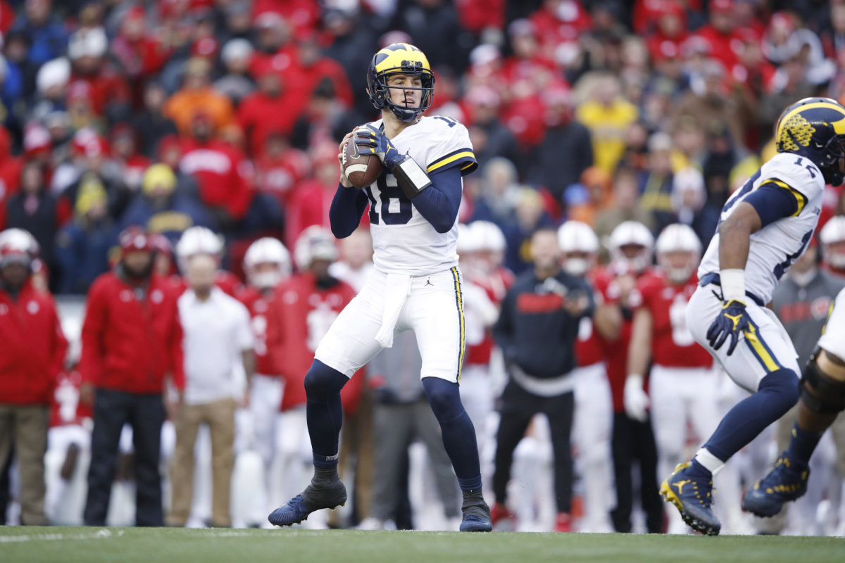 Michigan's Brandon Peters drops back to throw against Wisconsin.