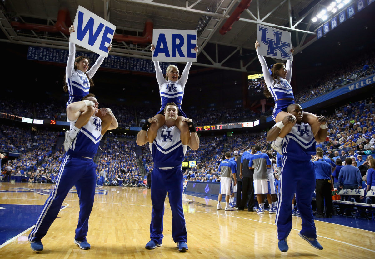 Kentucky cheerleaders on the court at Rupp Arena.