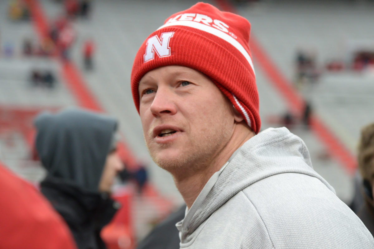 Scott Frost wears a Nebraska football hat coaching against Michigan State.