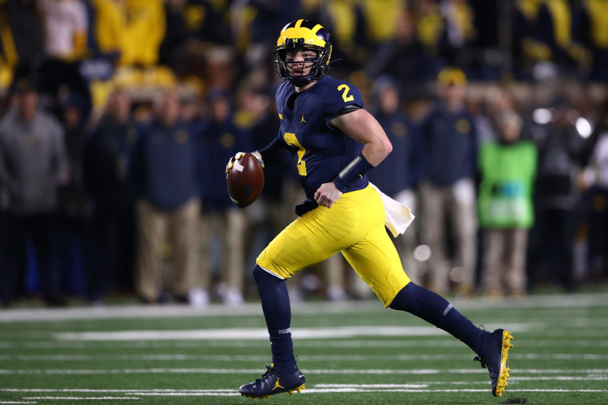 Shea Patterson of the Michigan Wolverines looks to pass.
