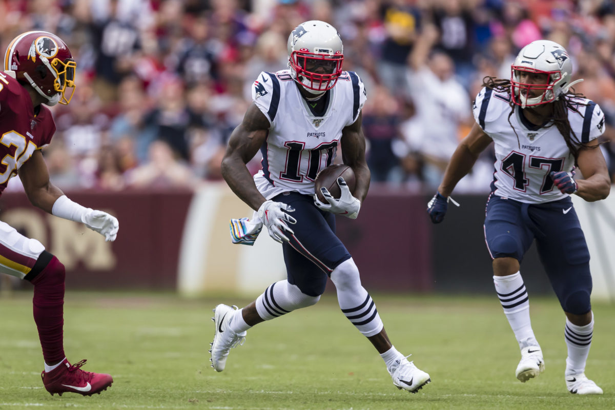 Josh Gordon runs after the catch for the New England Patriots.