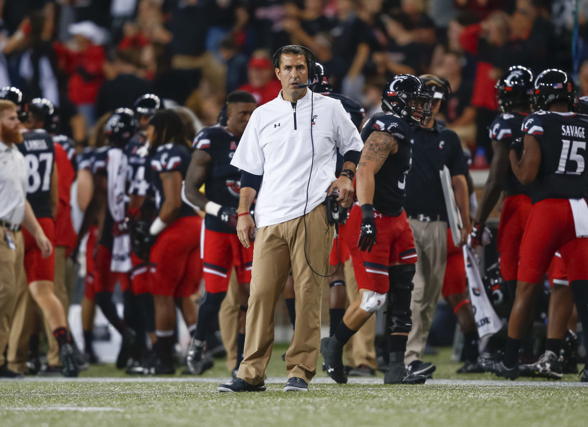Luke Fickell on the sideline with an untucked shirt.