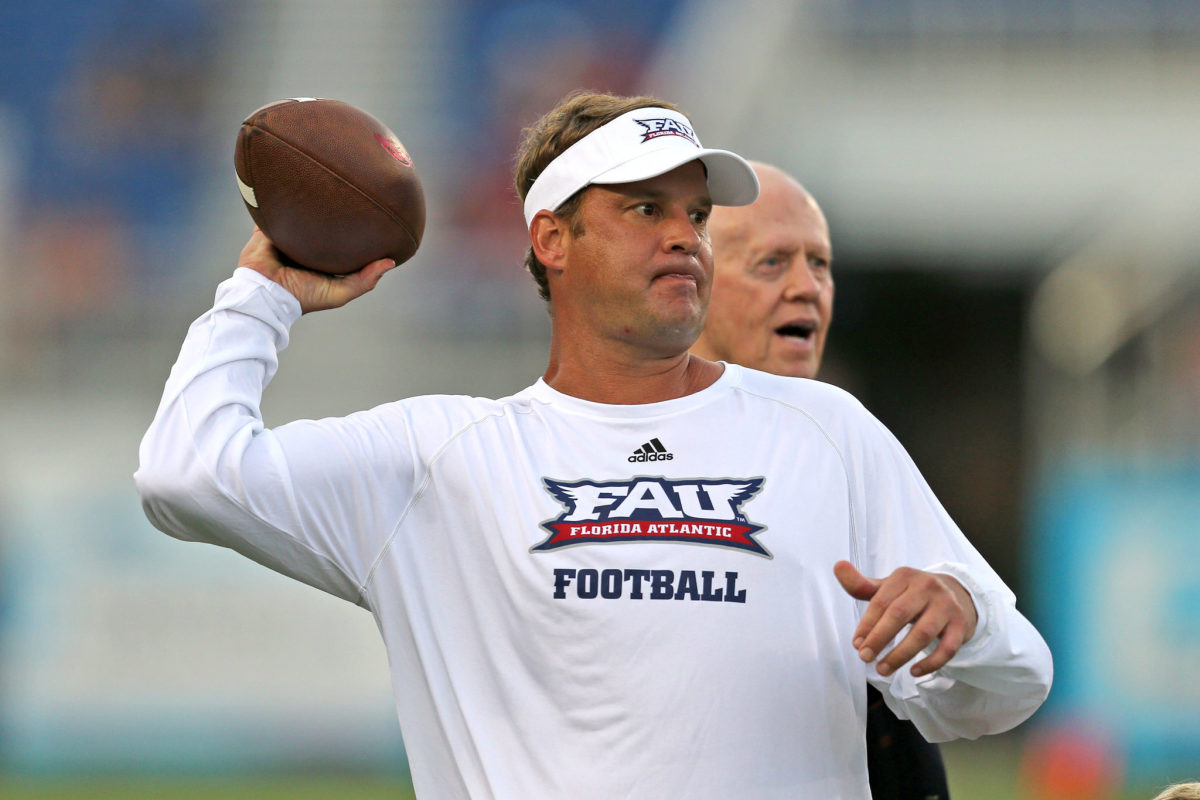 Head coach Lane Kiffin of the Florida Atlantic Owls throws the ball prior to the game against the Navy Midshipmen.