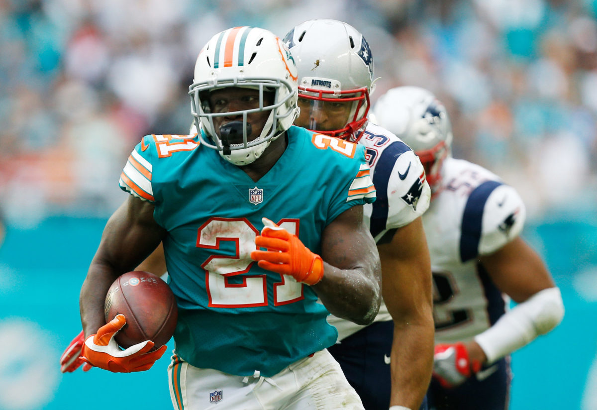 Frank Gore running with the ball for the Miami Dolphins.