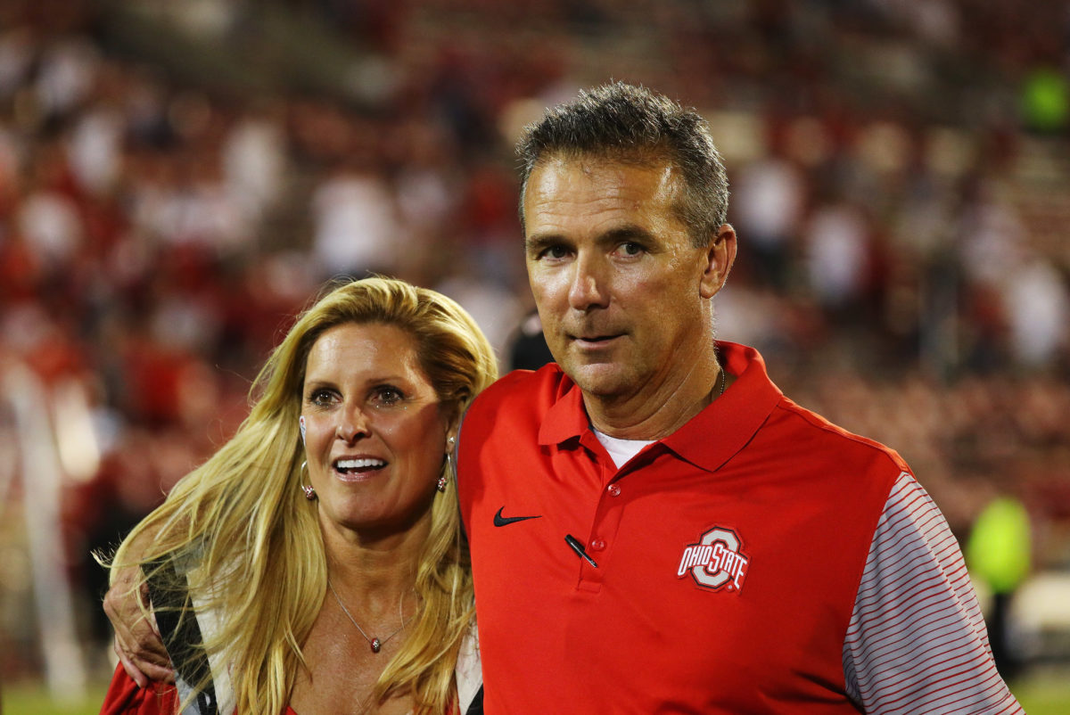 Urban Meyer with his wife after an Ohio State football game.