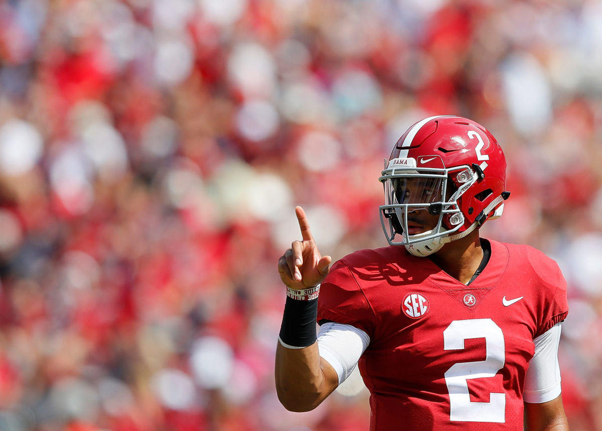 Jalen Hurts points to the sky.