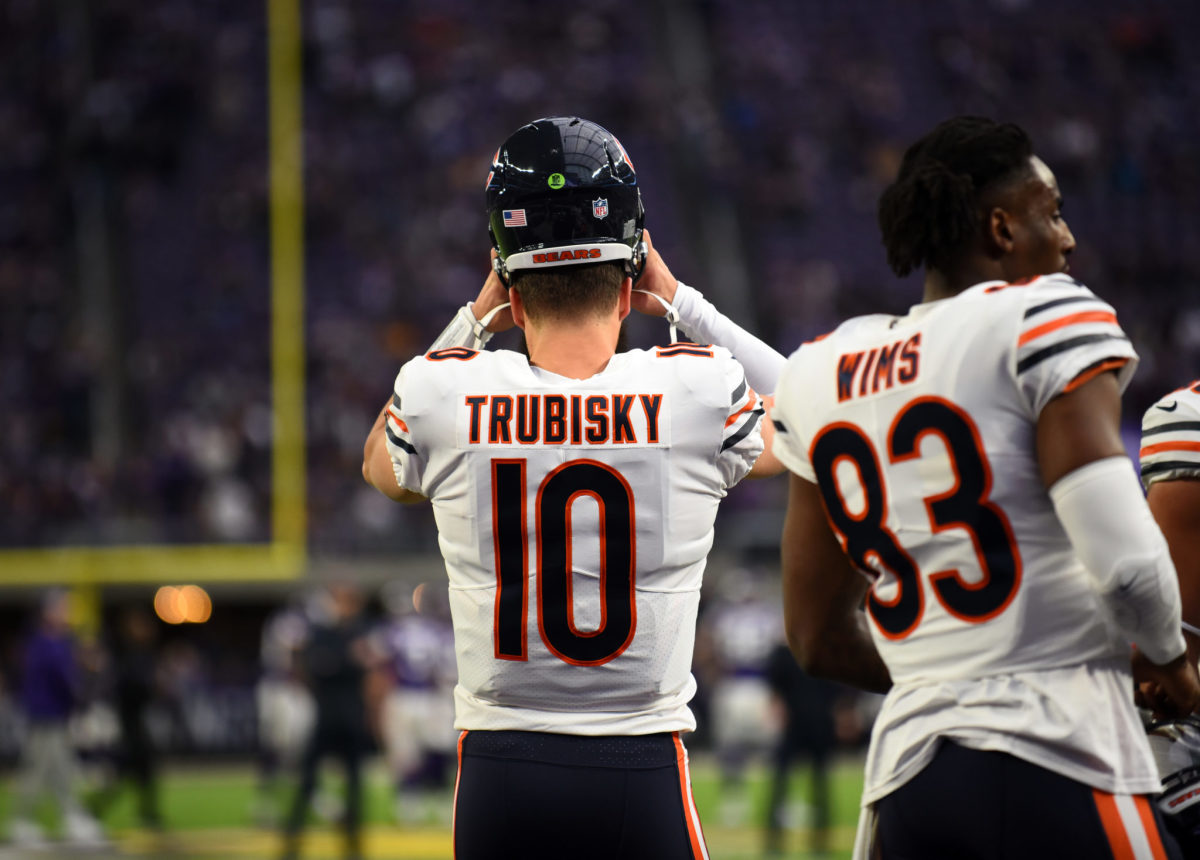 Bears QB Mitchell Trubisky putting his helmet on during a game.