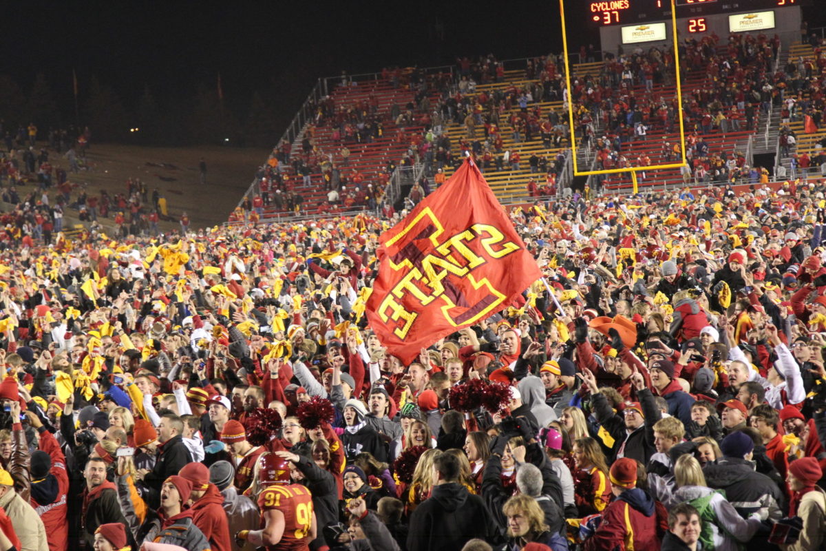 Iowa State Cyclones college football fans rush the field after an upset win against the Oklahoma State Cowboys at Jack Trice Stadium.