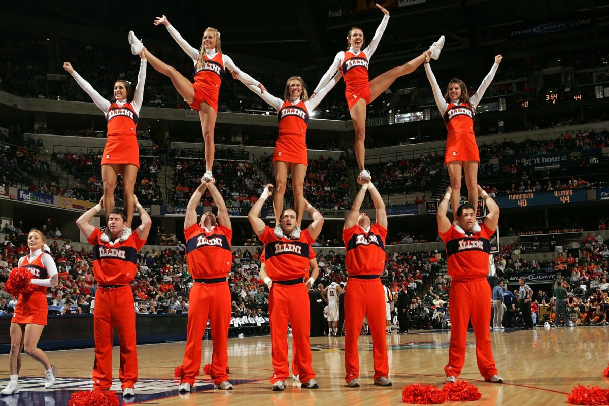 Illinois cheerleaders performing during a basketball game.