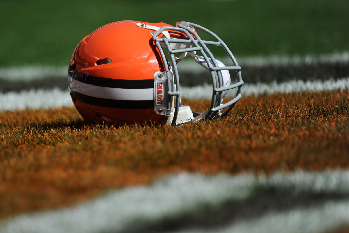 A closeup of a Cleveland Browns helmet on the field.
