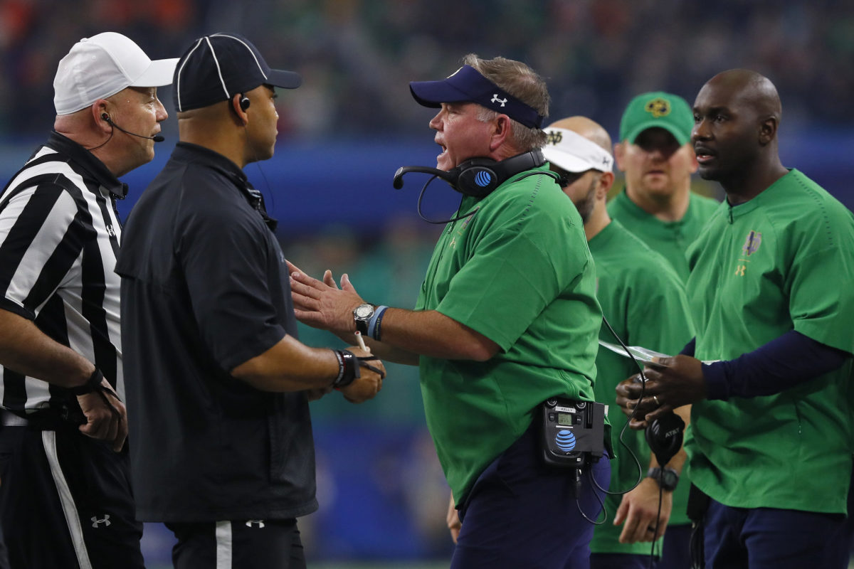 Brian Kelly of Notre Dame argues with the officials.