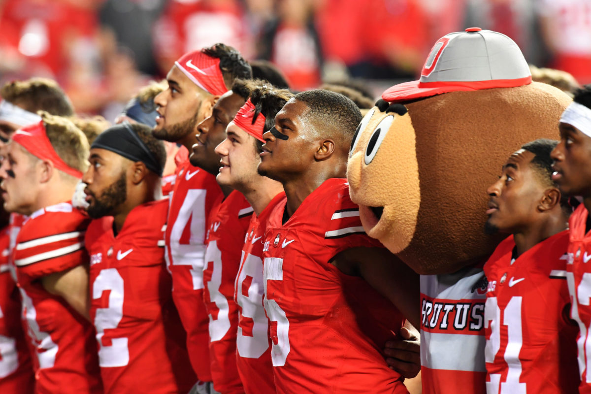 The Ohio State Buckeyes standing together after a game.