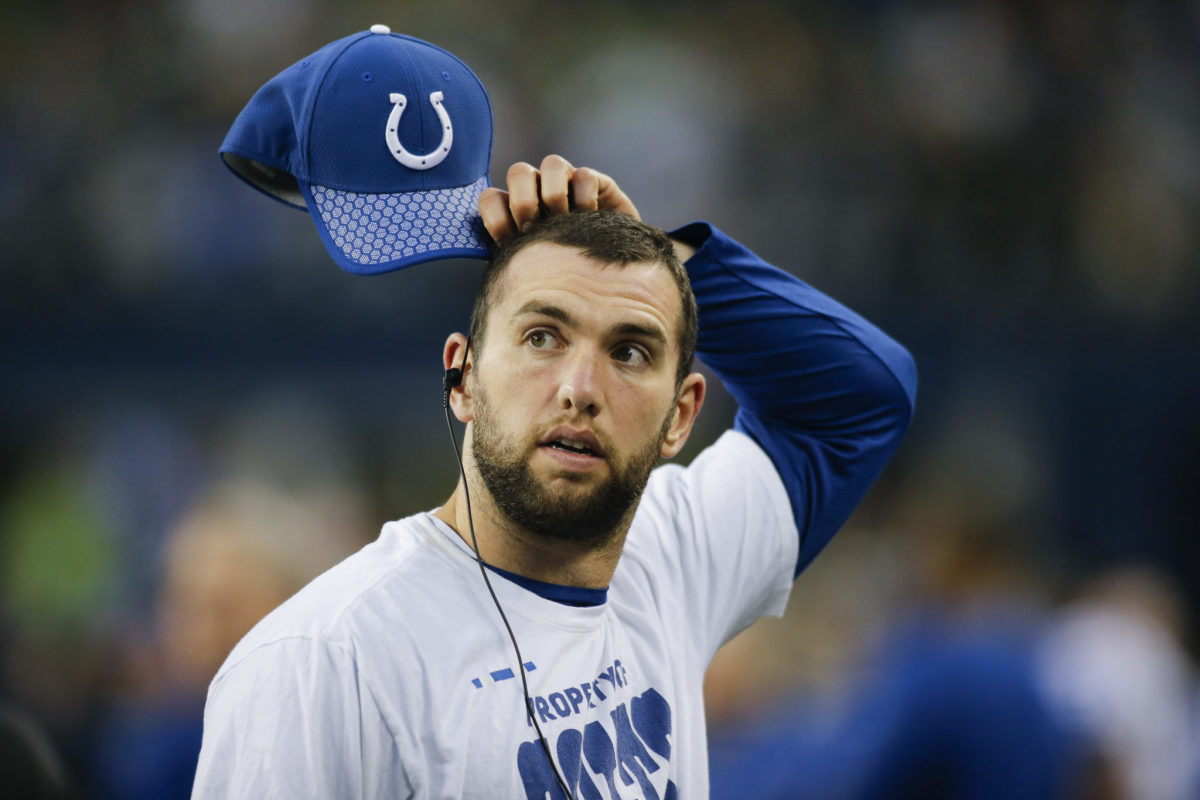 Colts QB Andrew Luck scratches his head before a game.