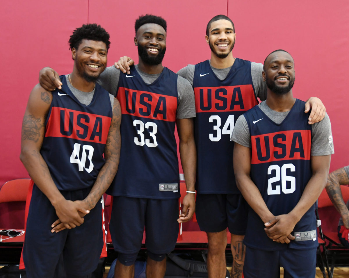 USA basketball players pose for a photo.