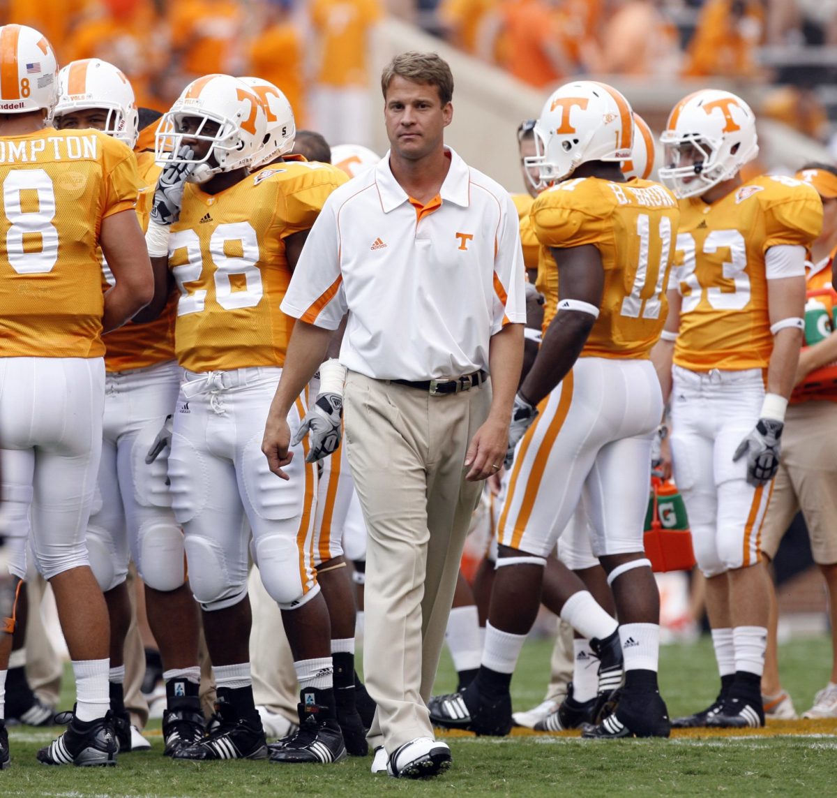 Lane Kiffin walking out of the Tennessee huddle.
