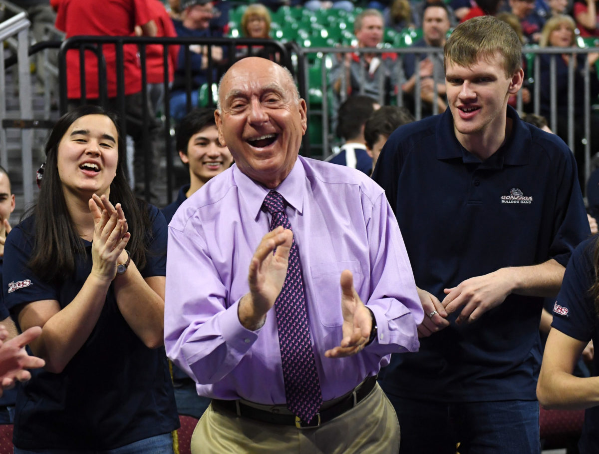 Dick Vitale celebrating during a basketball game.