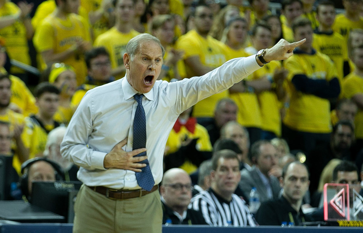 Michigan basketball head coach John Beilein pointing and yelling during a game.