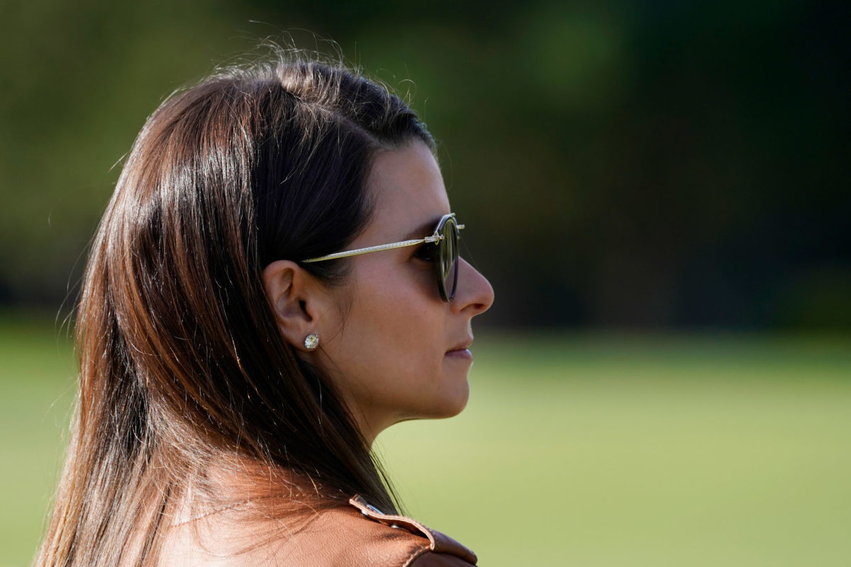 Danica Patrick watches Aaron Rodgers at the Pebble Beach Pro-Am.