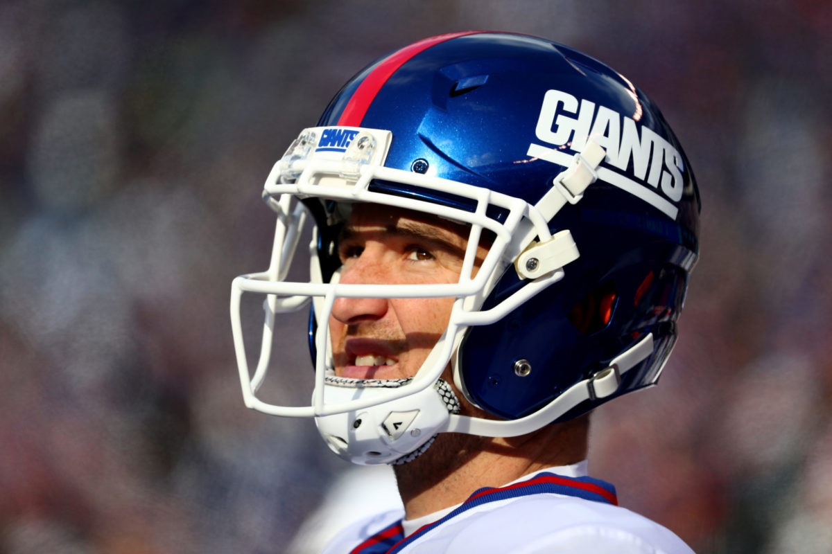 A closeup of Eli Manning in a retro New York Giants helmet?