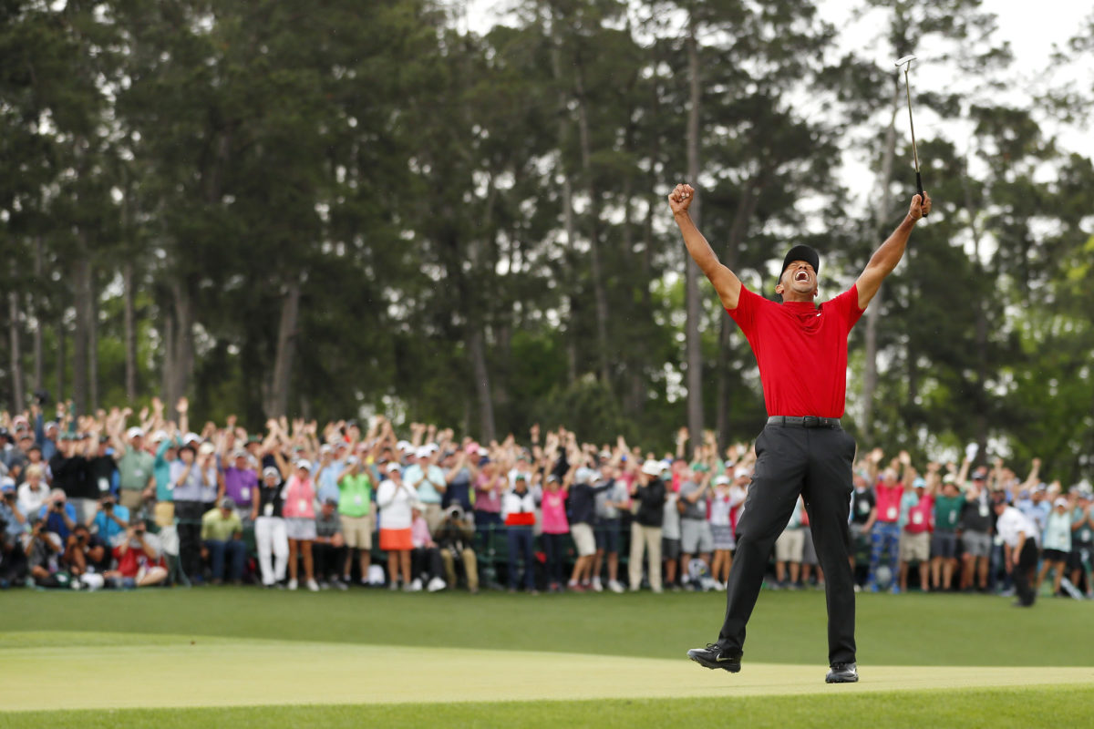 tiger woods celebrates his win at the masters