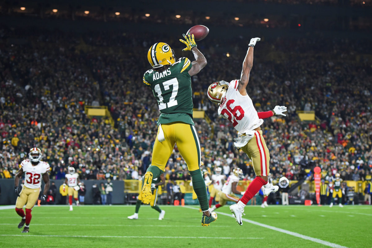 BALTIMORE, MD - DECEMBER 19: Packers wide receiver Davante Adams (17) runs  after a catch during the Green Bay Packers versus Baltimore Ravens NFL game  at M&T Bank Stadium on December 19