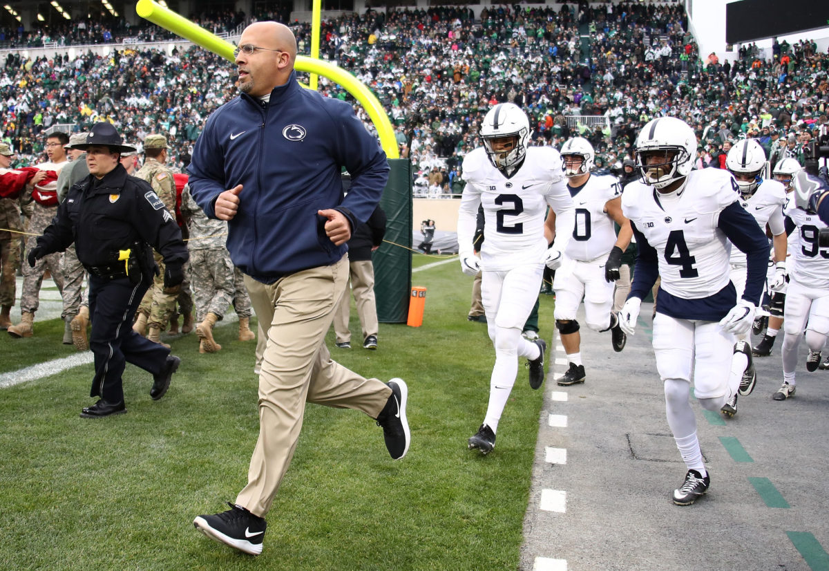 James Franklin leading Penn State onto the field.
