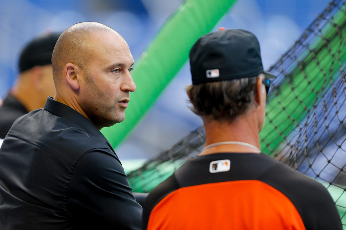 MLB's Miami Marlins part owner Derek Jeter, a former New York Yankees star, talking to Don Mattingly prior to a game.