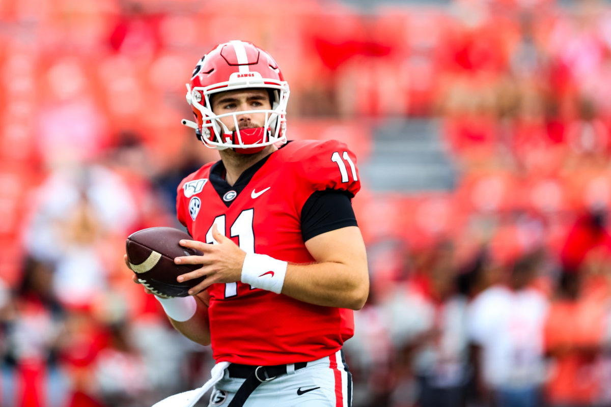 Jake Fromm warms up before a game against Arkansas State.