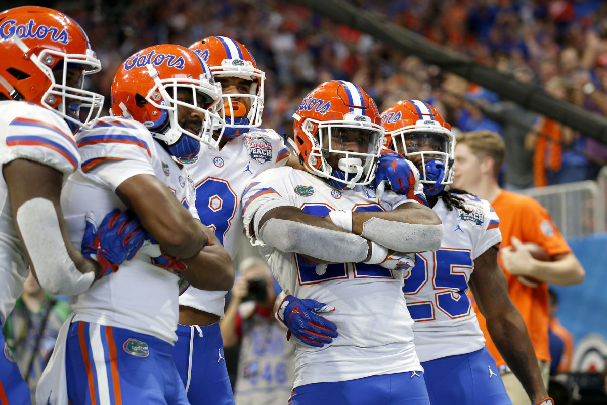 Florida football players celebrating a touchdown.