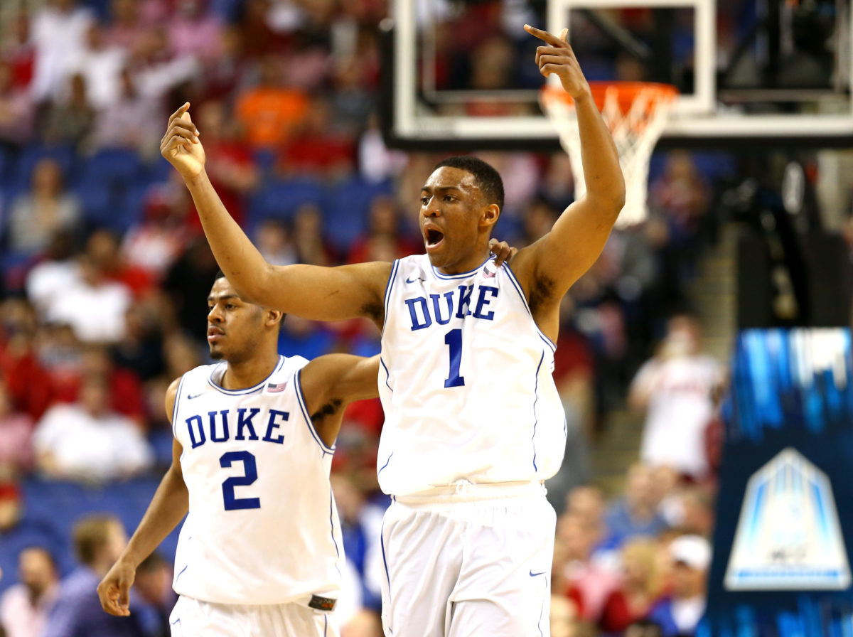 Jabari Parker and Quinn Cook on the floor against NC State.