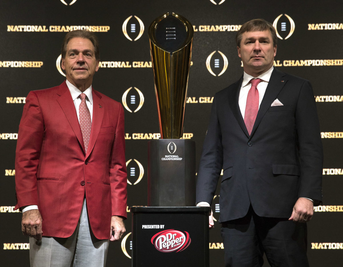 SEC coaches Nick Saban and Kirby Smart, with the College Football Playoff trophy.