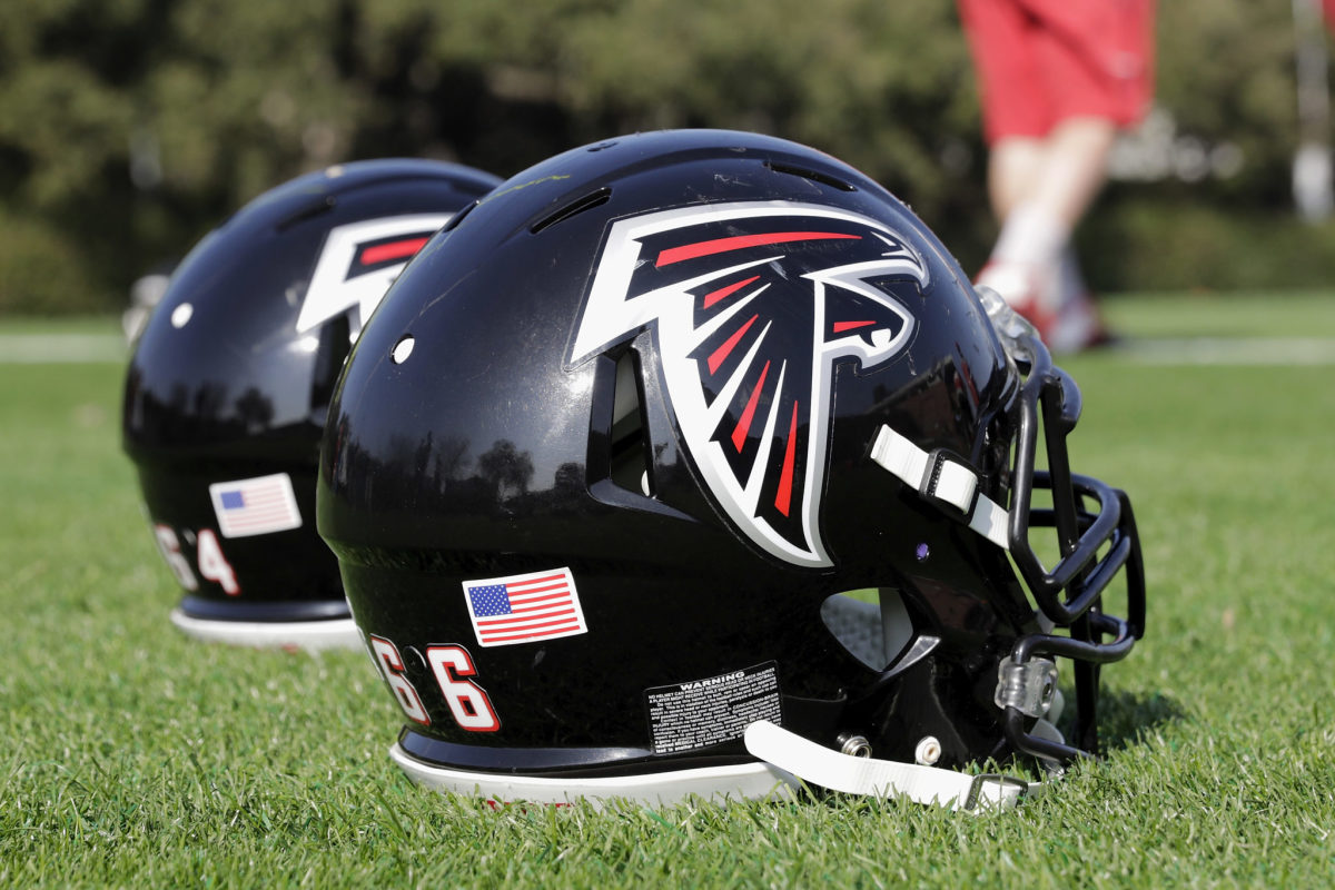 Atlanta Falcons helmets sitting on the field.