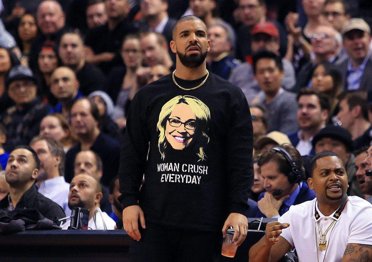 Drake wearing a Doris Burke t-shirt at a Raptors game.