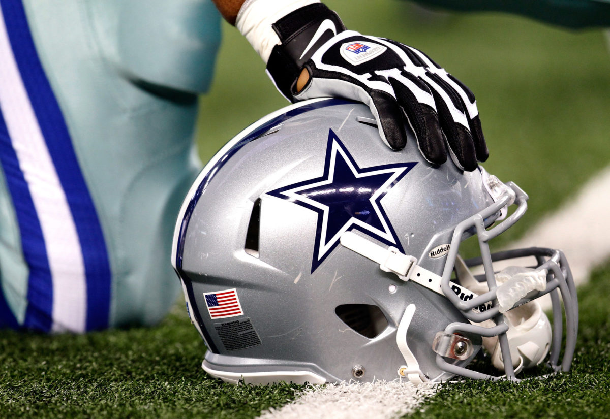 A closeup of a Dallas Cowboys football helmet.
