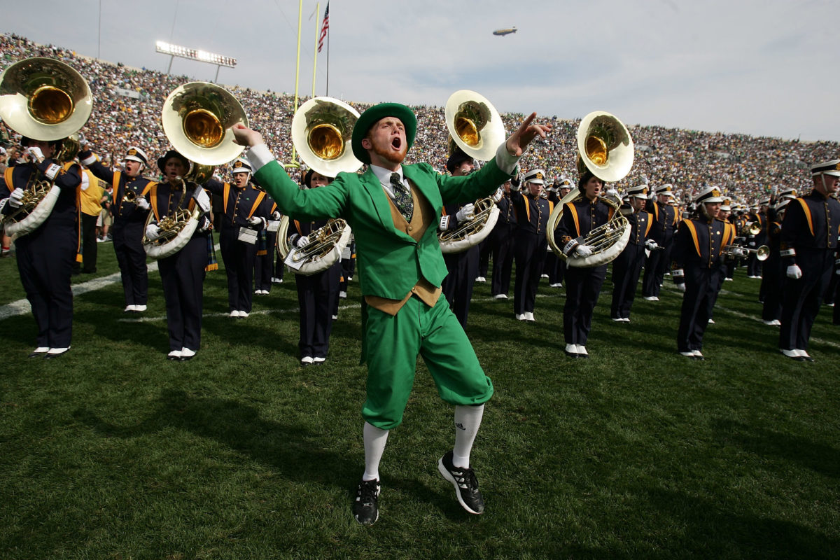 Notre Dame's mascot dancing with the band.