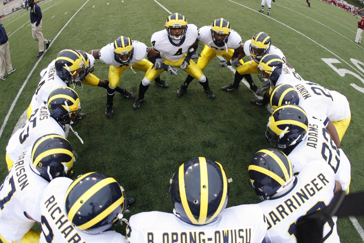 The defensive backs for Michigan huddle up prior to action between the Michigan Wolverines and Indiana Hoosiers.