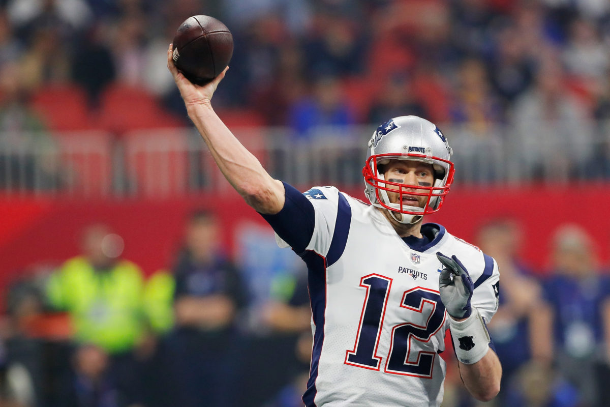 tom brady throws a pass during the super bowl