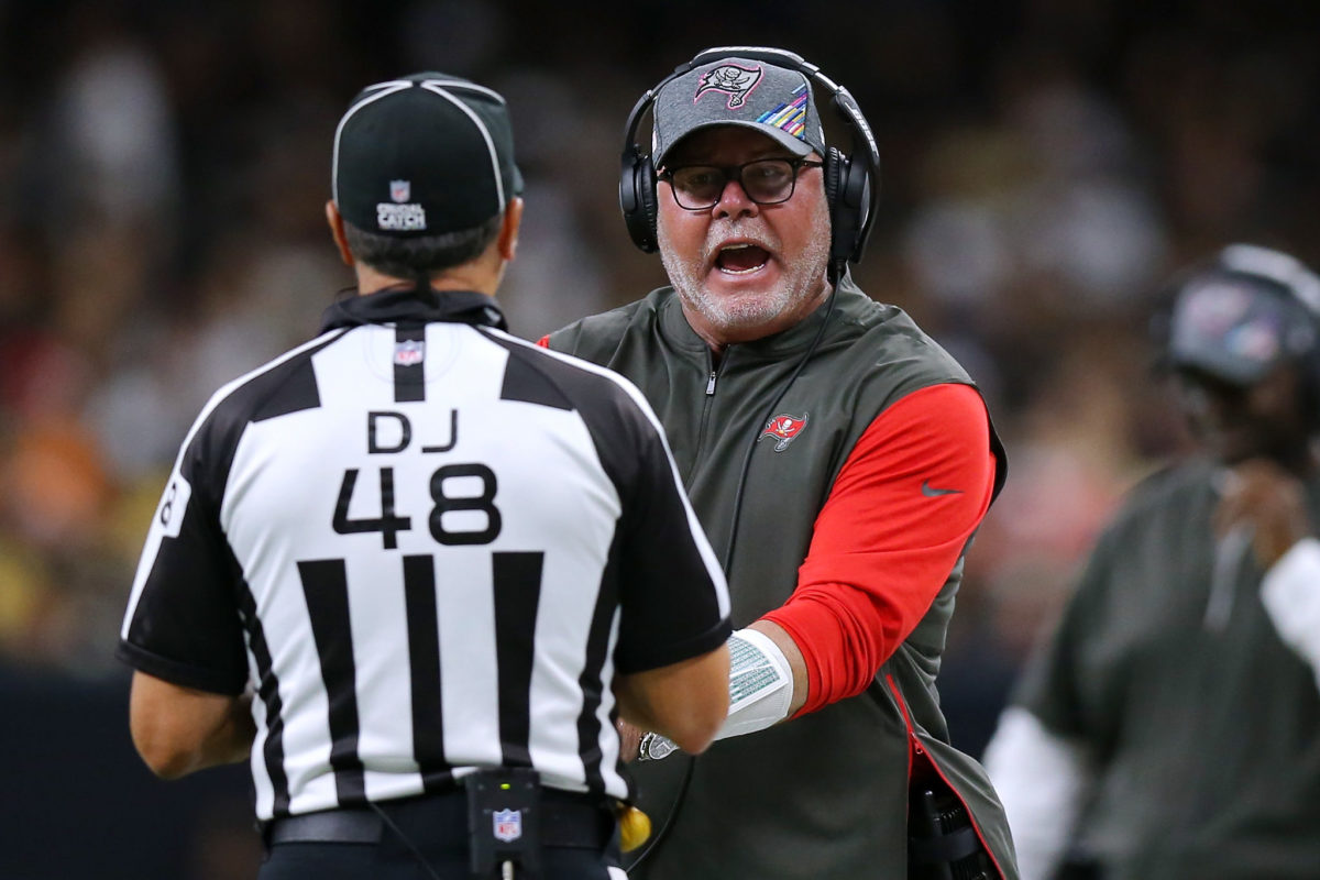 Bruce Arians argues with an official during a game.